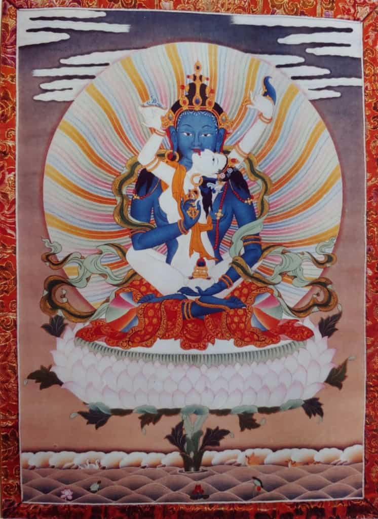 Vibrant Thangka painting of the goddess Vajrayogini seated on a lotus, showcasing traditional Tibetan Buddhist art.